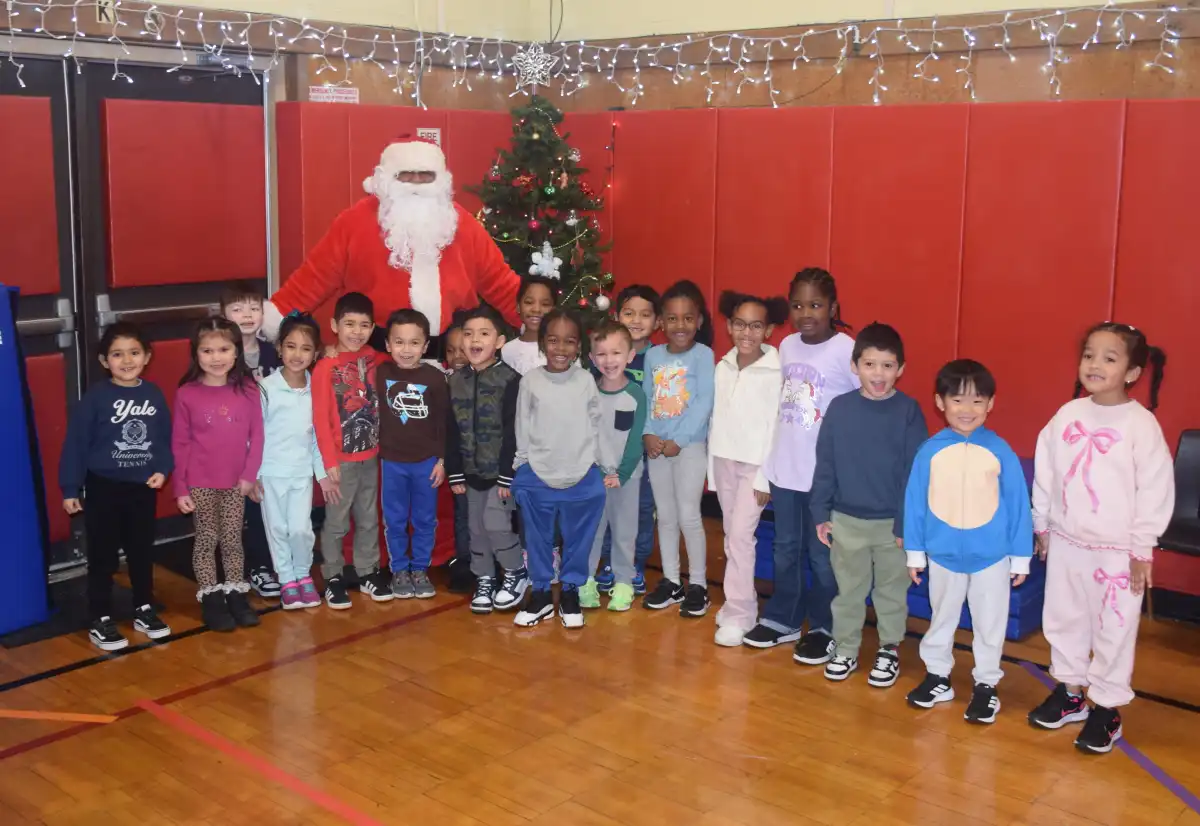 Santa Claus thrills in surprise visit to Amityville elementary students