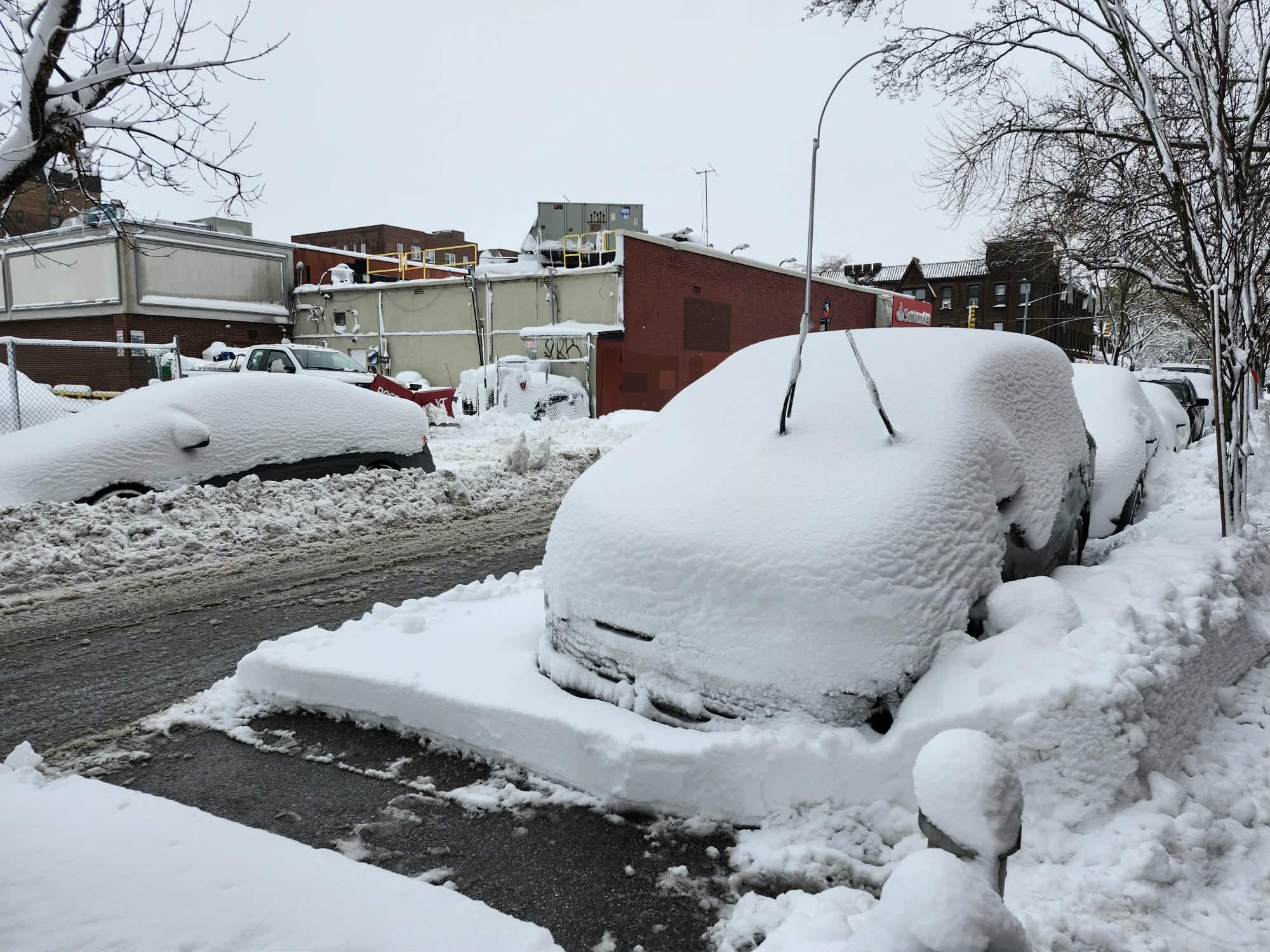 New Yorkers with arduous task of removing accumulated snow after historic blizzard 
