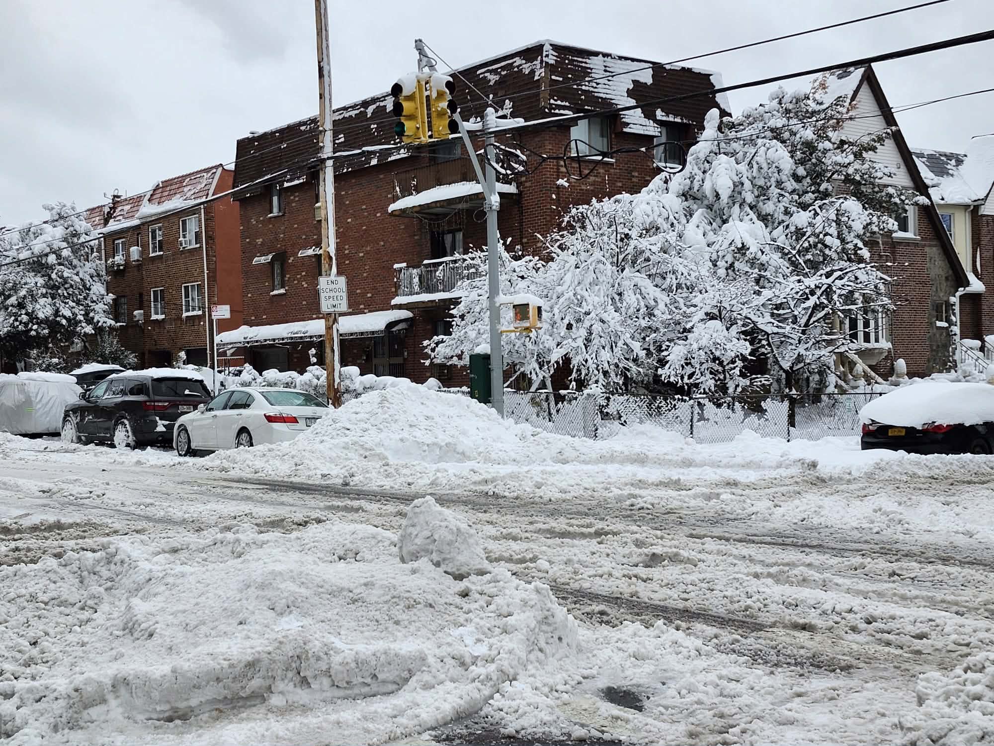 New Yorkers with arduous task of removing accumulated snow after historic blizzard 