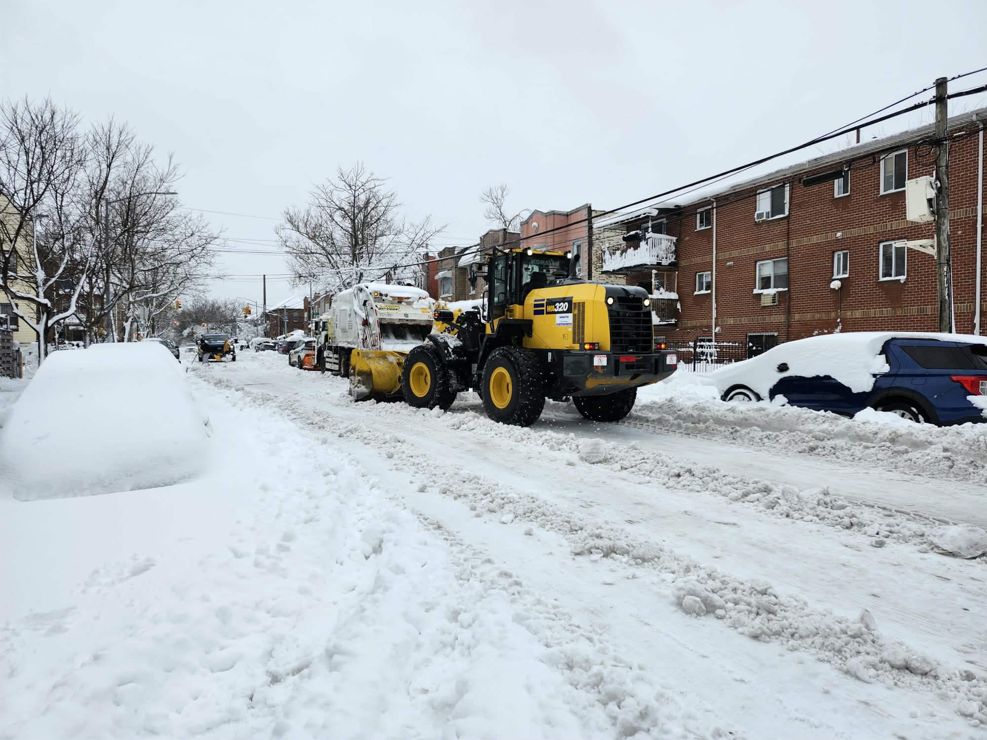 New Yorkers with arduous task of removing accumulated snow after historic blizzard 
