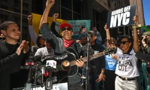 Tom Morello of Rage Against the Machine protests against ICE in front of 26 Federal Plaza