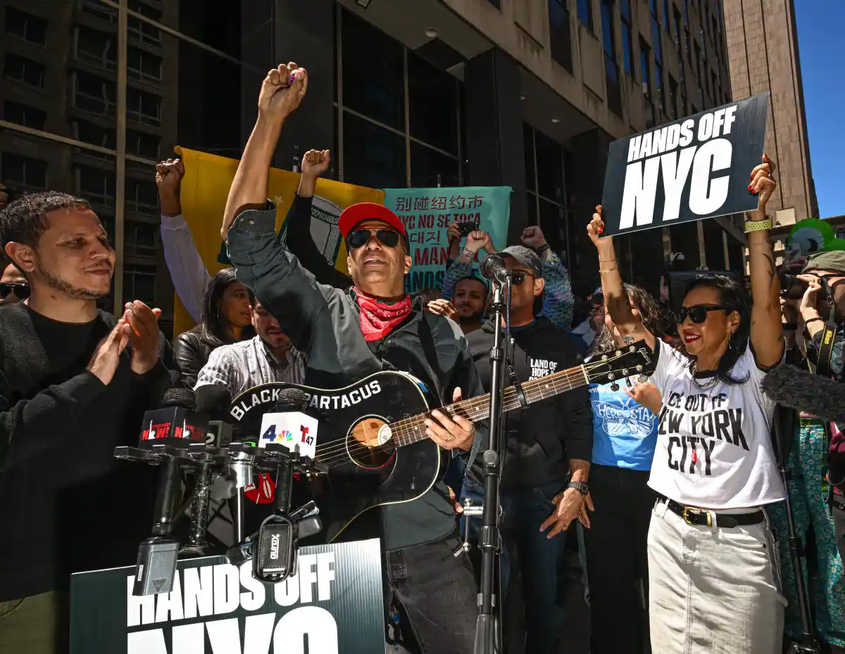 Tom Morello of Rage Against the Machine protests against ICE in front of 26 Federal Plaza