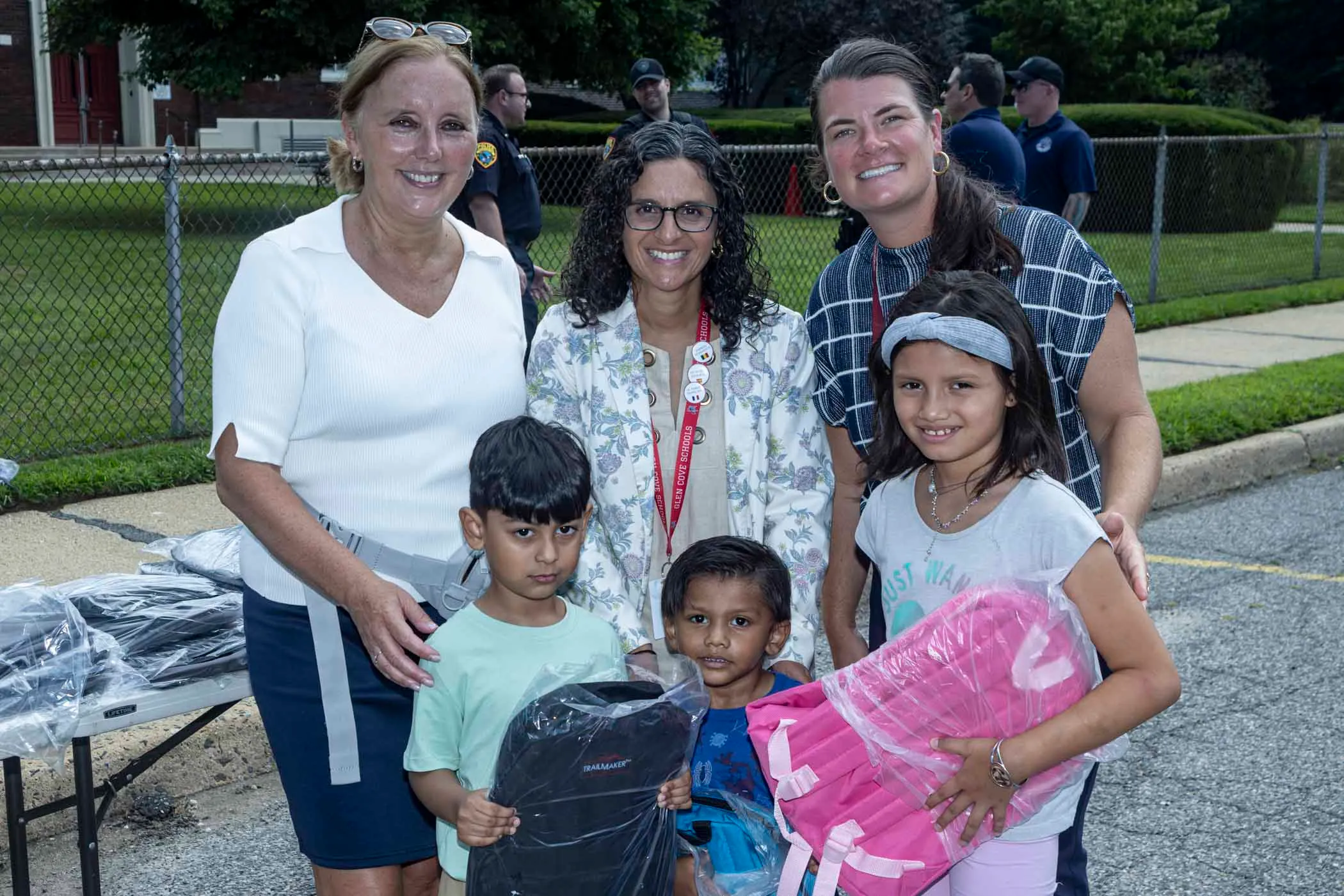 Legislator DeRiggi-Whitton and the Nassau PBA deliver backpacks for back to school