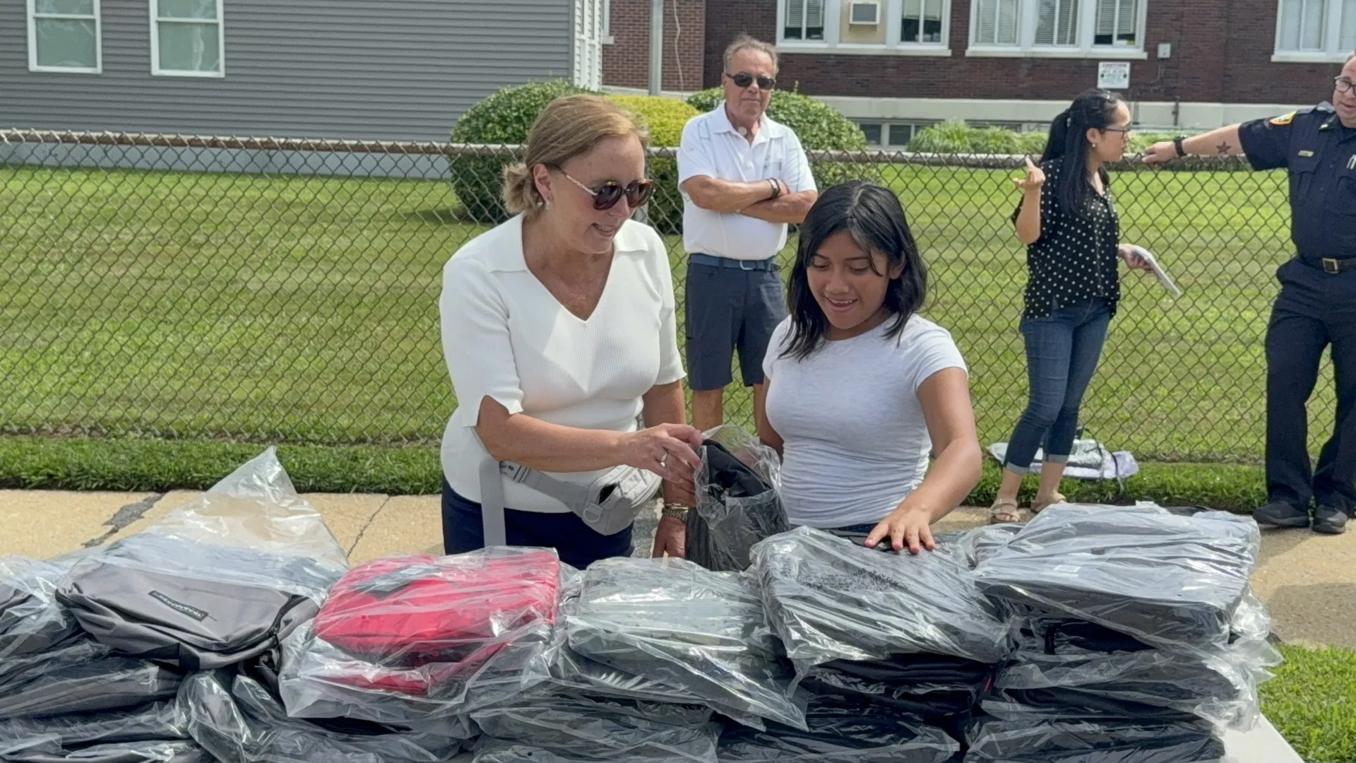 Legislator DeRiggi-Whitton and the Nassau PBA deliver backpacks for back to school