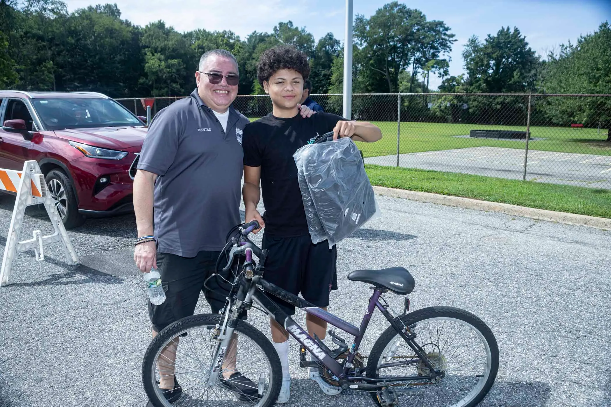 Legislator DeRiggi-Whitton and the Nassau PBA deliver backpacks for back to school