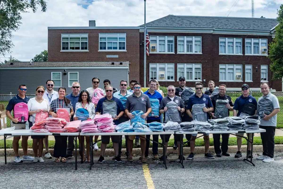 Legislator DeRiggi-Whitton and the Nassau PBA deliver backpacks for back to school