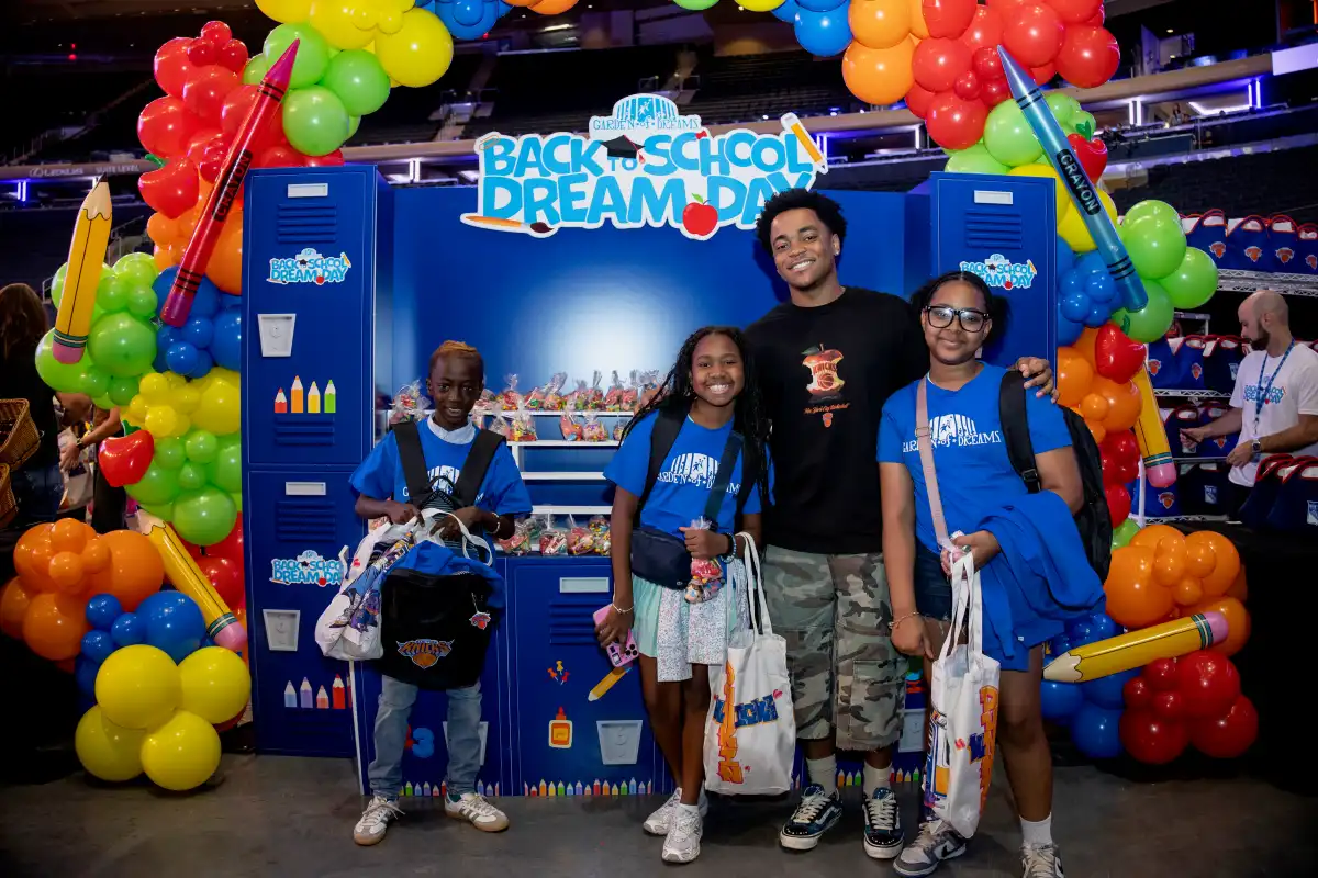 “Back-To-School Dream Day”: 350 children receive school supplies and pose with the Knicks trophy at Madison Square Garden