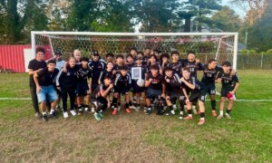 Amityville football coach Mike Abbondondolo celebrates his 200th career victory